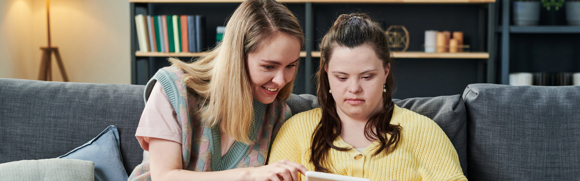 mother and child looking at the tablet device