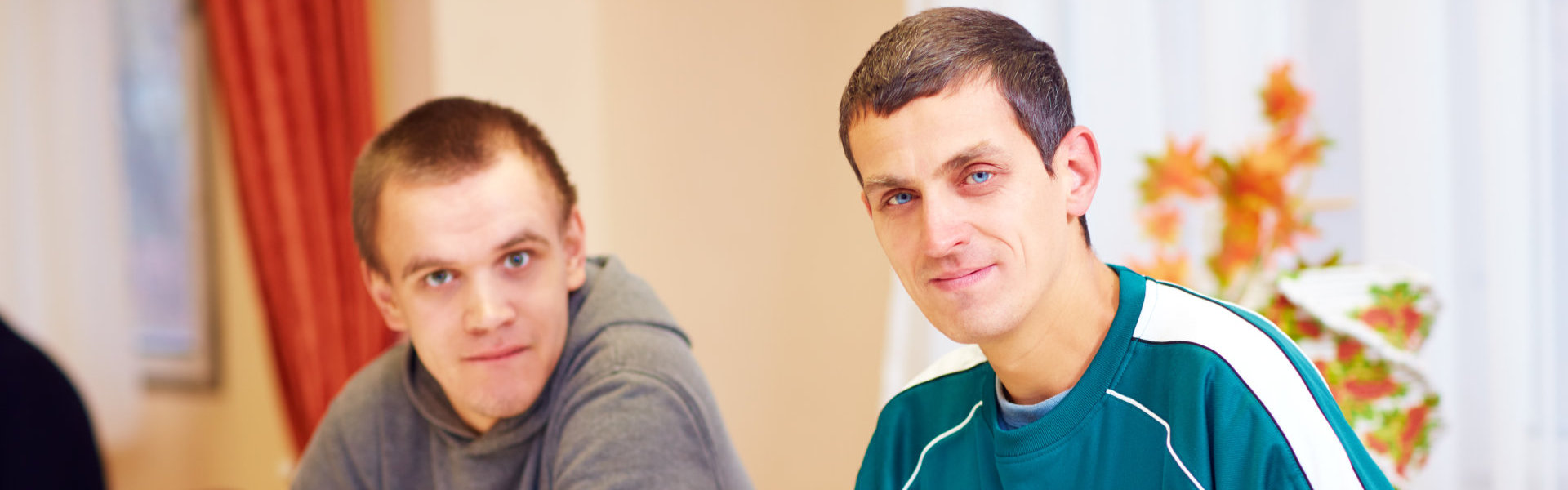 two men sitting together